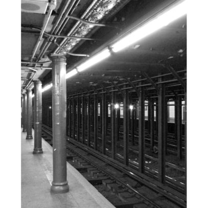 This is an original and signed black and white fine art photograph of New York City subway station.