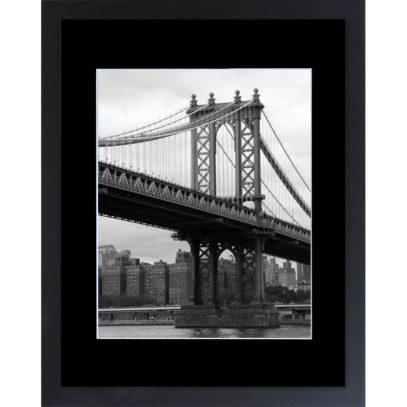 This is a black and white fine art photograph of the Manhattan Bridge in New York City, as seen from the East River.